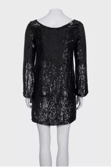 Black dress decorated with sequins with long sleeves