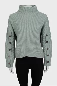Cashmere sweater with buttons on the sleeves