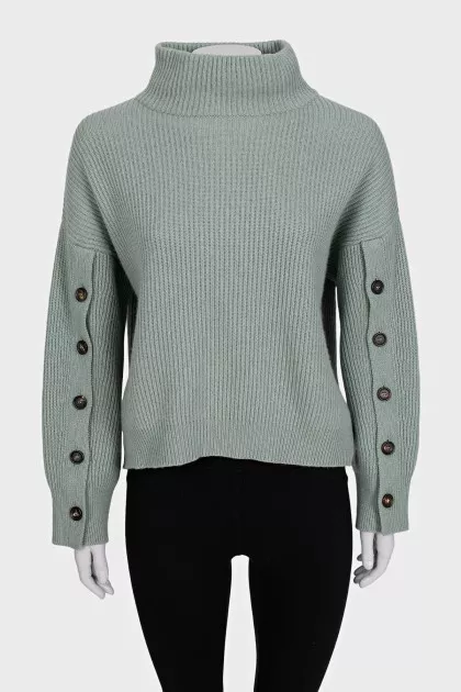 Cashmere sweater with buttons on the sleeves
