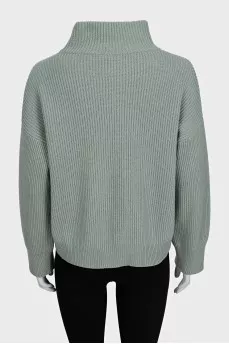 Cashmere sweater with buttons on the sleeves