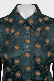Green fitted dress with a print
