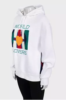 White hoodie decorated with embroidery