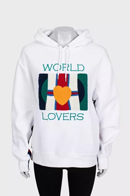 White hoodie decorated with embroidery