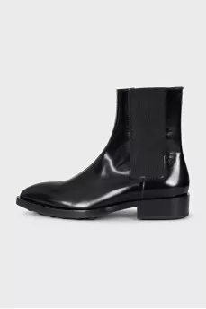 Black leather pointed toe boots
