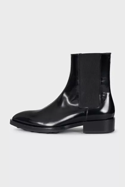 Black leather pointed toe boots