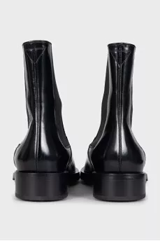 Black leather pointed toe boots