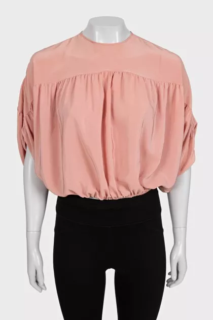 Cropped silk blouse with a button