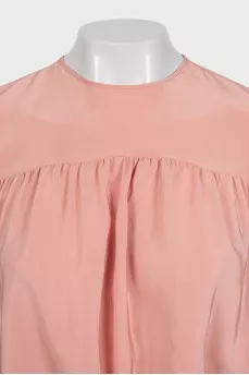 Cropped silk blouse with a button