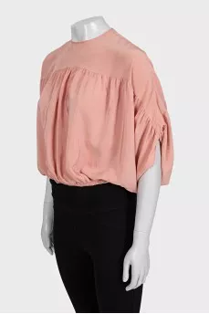 Cropped silk blouse with a button