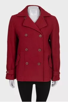 Red double-breasted coat with a short cut