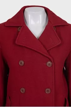 Red double-breasted coat with a short cut