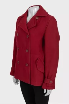 Red double-breasted coat with a short cut