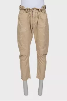 Men's beige trousers with abrasions
