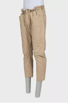 Men's beige trousers with abrasions