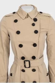Beige fitted button-down trench coat with belt