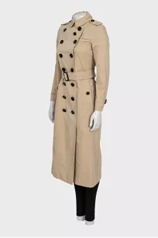Beige fitted button-down trench coat with belt