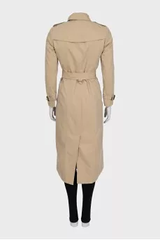 Beige fitted button-down trench coat with belt