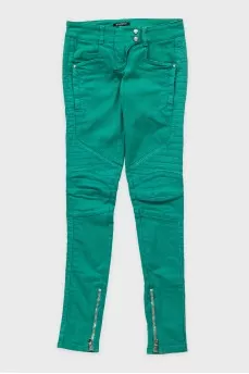 Green skinny fit jeans with decorative zippers