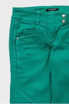 Green skinny fit jeans with decorative zippers