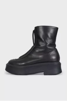 Black leather boots with a zipper