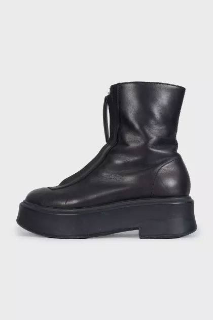 Black leather boots with a zipper