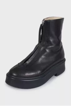 Black leather boots with a zipper