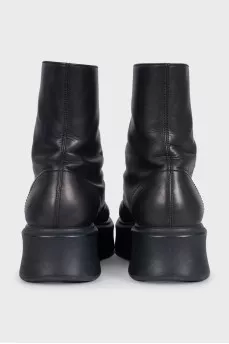 Black leather boots with a zipper