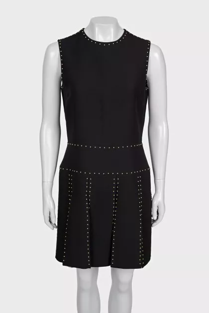 Black sleeveless dress with gold trim