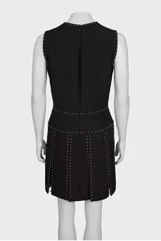Black sleeveless dress with gold trim