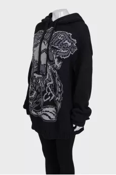 Oversized, elongated hoodie with a printed pattern