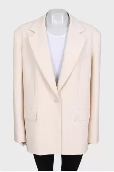 Beige long jacket with a button
