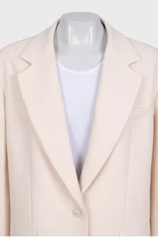 Beige long jacket with a button