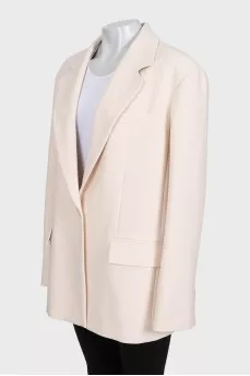Beige long jacket with a button