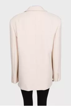 Beige long jacket with a button