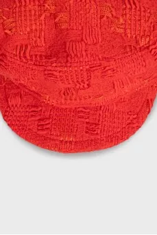 Red cap made of textured material