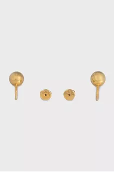 Gold earrings in the shape of spheres