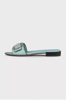 Blue leather flip-flops with gold trim