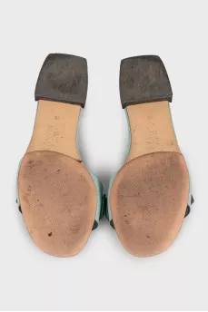 Blue leather flip-flops with gold trim
