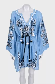Blue linen dress decorated with embroidery