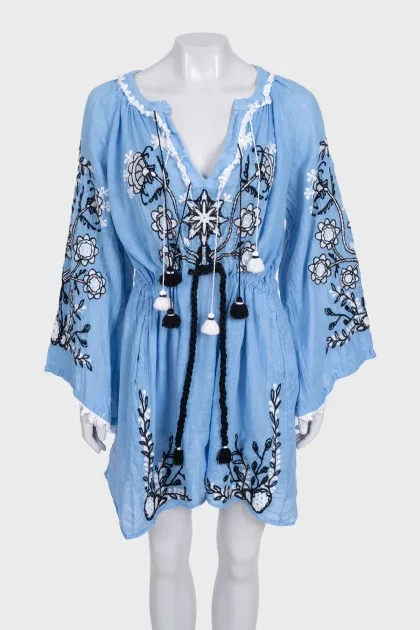 Blue linen dress decorated with embroidery