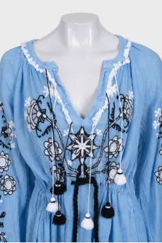 Blue linen dress decorated with embroidery
