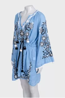 Blue linen dress decorated with embroidery
