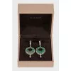 Gold earrings decorated with emeralds
