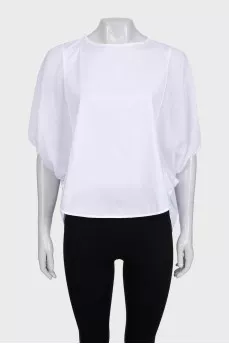 A loose blouse decorated with rhinestones