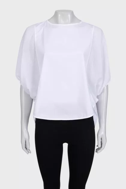 A loose blouse decorated with rhinestones