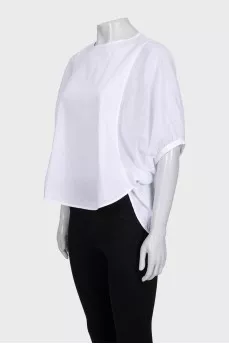 A loose blouse decorated with rhinestones