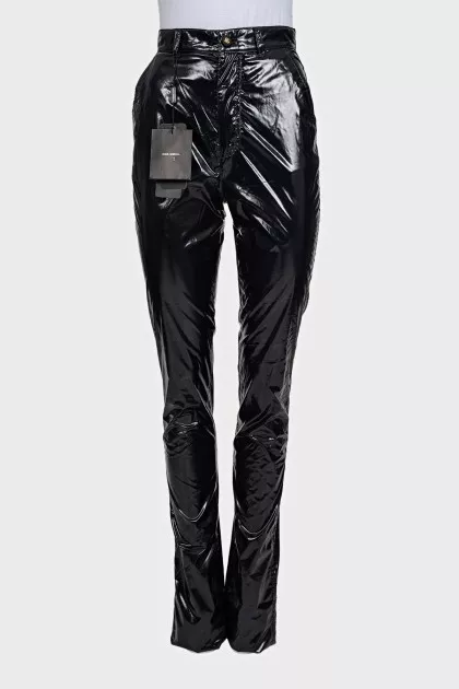 Black patent leather trousers with tag