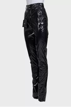 Black patent leather trousers with tag