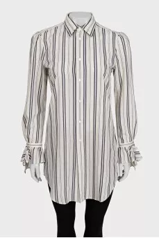 White shirt with striped print and tag