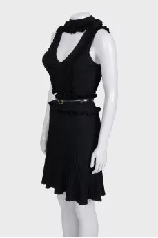 A fitted dress decorated with ruffles
